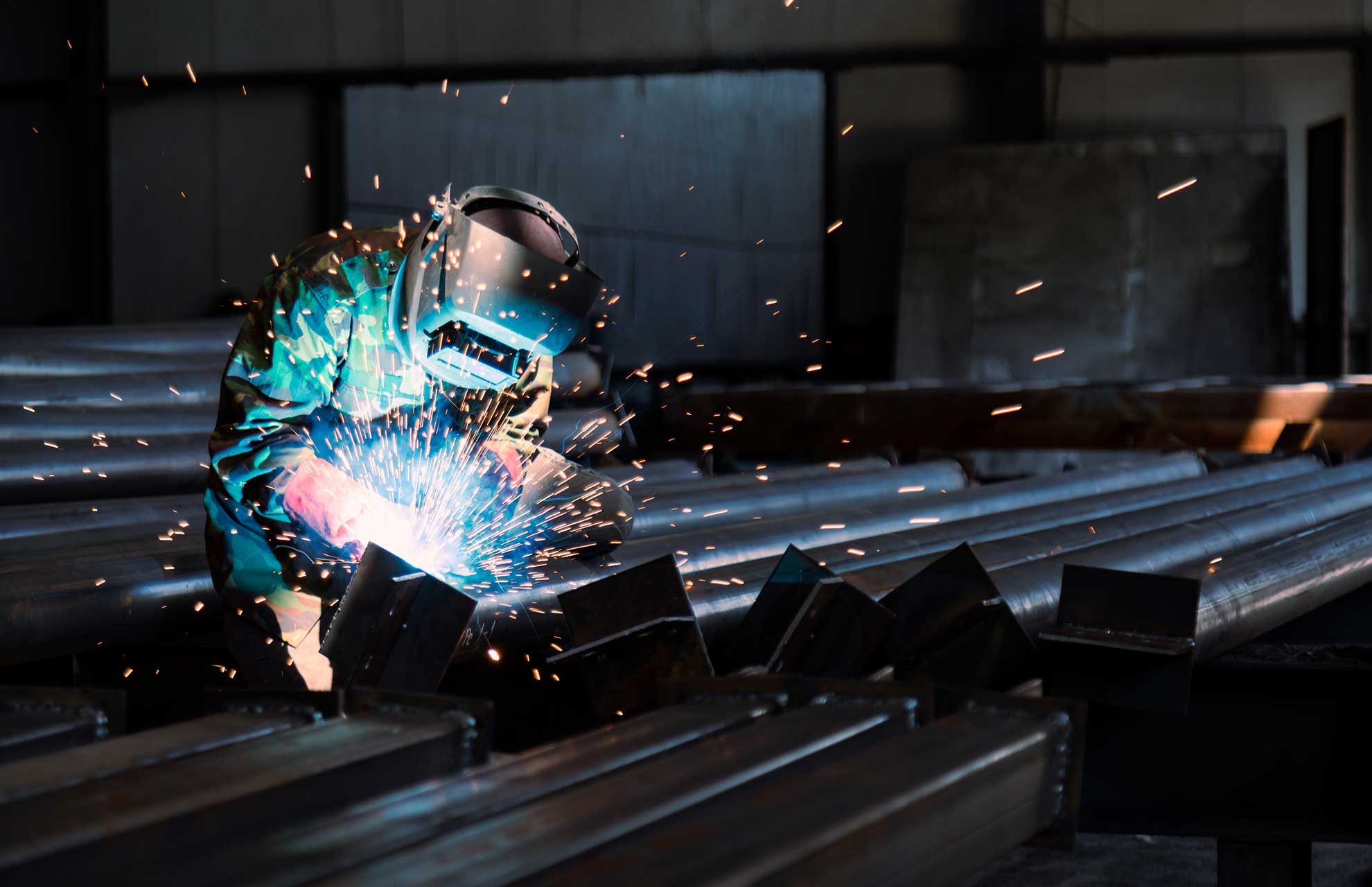 person welding metal
